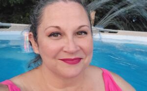 Melonie hanging out at home in her swimming pool.
